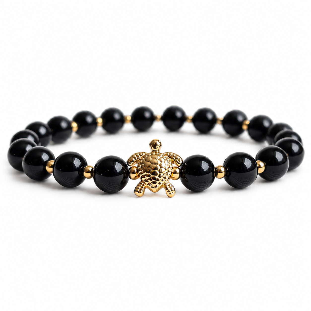 Black Onyx stone beaded bracelet with a gold turtle charm on a white background