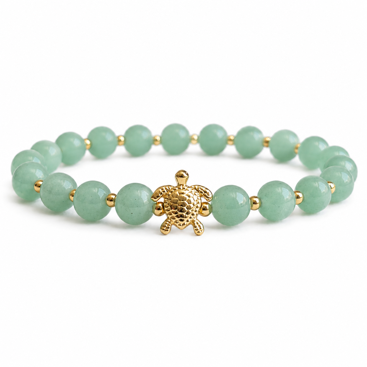 Green beaded bracelet with a gold turtle charm on a white background